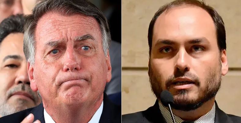 Imagem de Jair Bolsonaro e Carlos Bolsonaro durante evento político