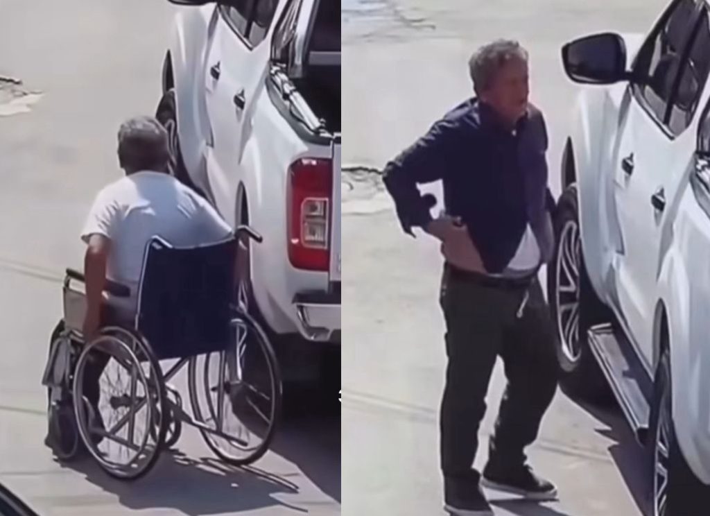 Homem simulando deficiência física em cadeira de rodas nas ruas